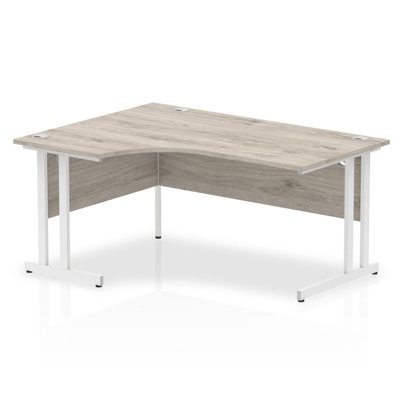 Beech and silver cantilever leg crescent desk by Dynamic Office Solutions with ergonomic design for modern office setups.