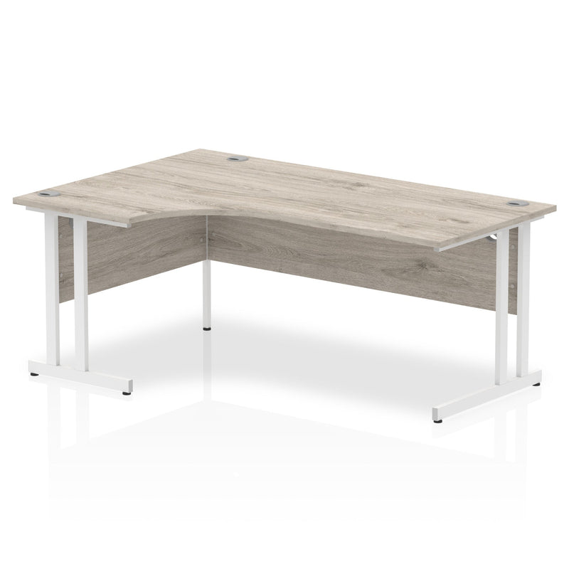 Beech corner desk with cantilever legs in silver, featuring cable management from Dynamic Office Solutions