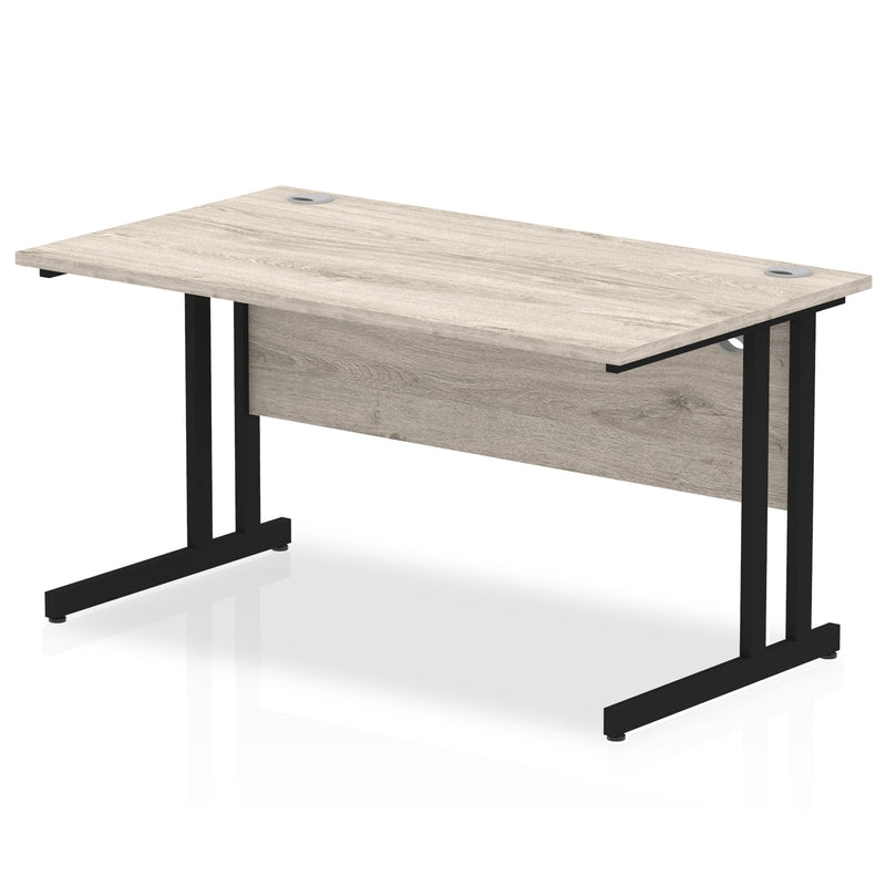 Dynamic Office Solutions 1400mm beech straight desk with cantilever legs in silver.