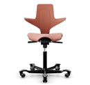Ergonomic HAG Capisco Puls 8020 saddle chair in rosehip color with silver aluminium base and adjustable gas lift.