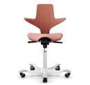 Ergonomic HAG Capisco Puls 8020 saddle chair in rosehip color with silver aluminium base and adjustable gas lift