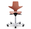 Ergonomic HAG Capisco Puls 8020 saddle chair in rosehip color with adjustable height gas lift and aluminum base
