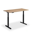 Height adjustable Lavoro Rusa desk with wood grain top in black frame and anthracite Sherman oak finish.