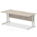Dynamic Office Solutions Beech straight desk with silver cantilever legs, ideal for executive home offices.