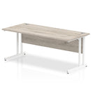 Beech top straight desk with silver cantilever legs from Dynamic Office Solutions, ideal for executive office setups.