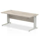 Dynamic Office Solutions Impulse 1800mm beech desk with silver cantilever legs and cable management features.