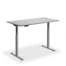 Dual motor height adjustable desk with textured black top and black frame by Lavoro.