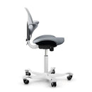 Light grey ergonomic saddle chair with silver aluminum base, HAG Capisco Puls 8020 design.